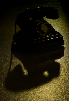 Bakelite telephone in shadow